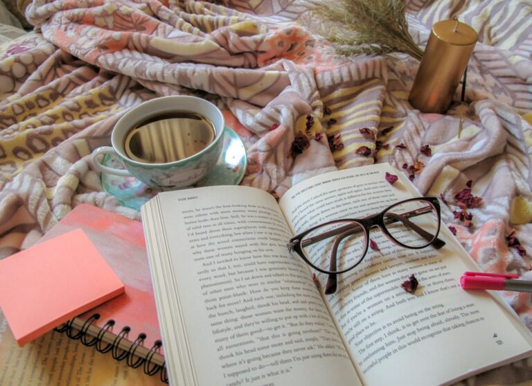 black framed eyeglasses on book page