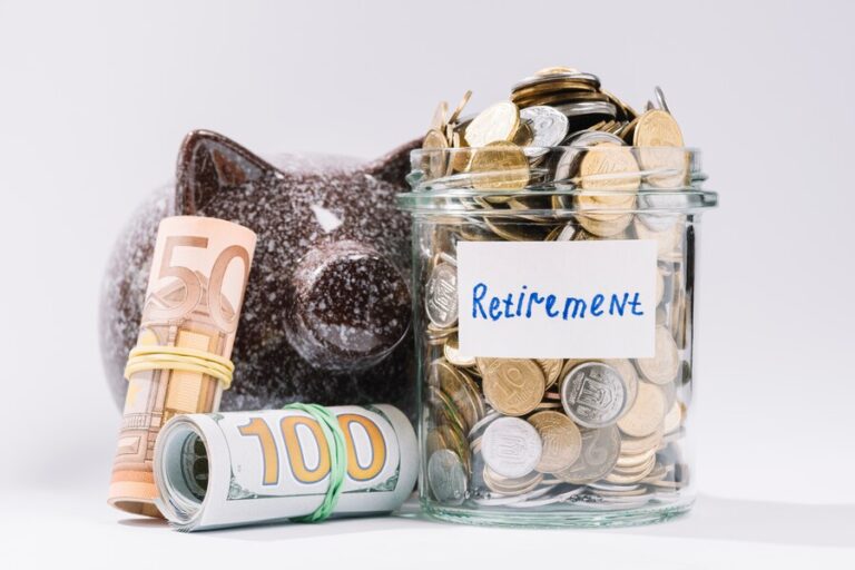 rolled-up-banknotes-piggybank-retirement-container-full-coins-white-backdrop_23-2147919312